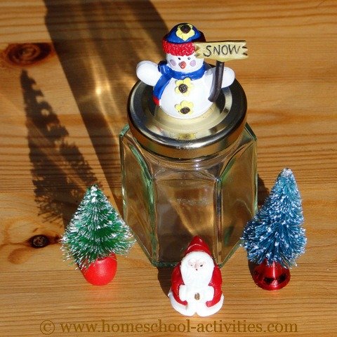 glass jar and snow globe figures